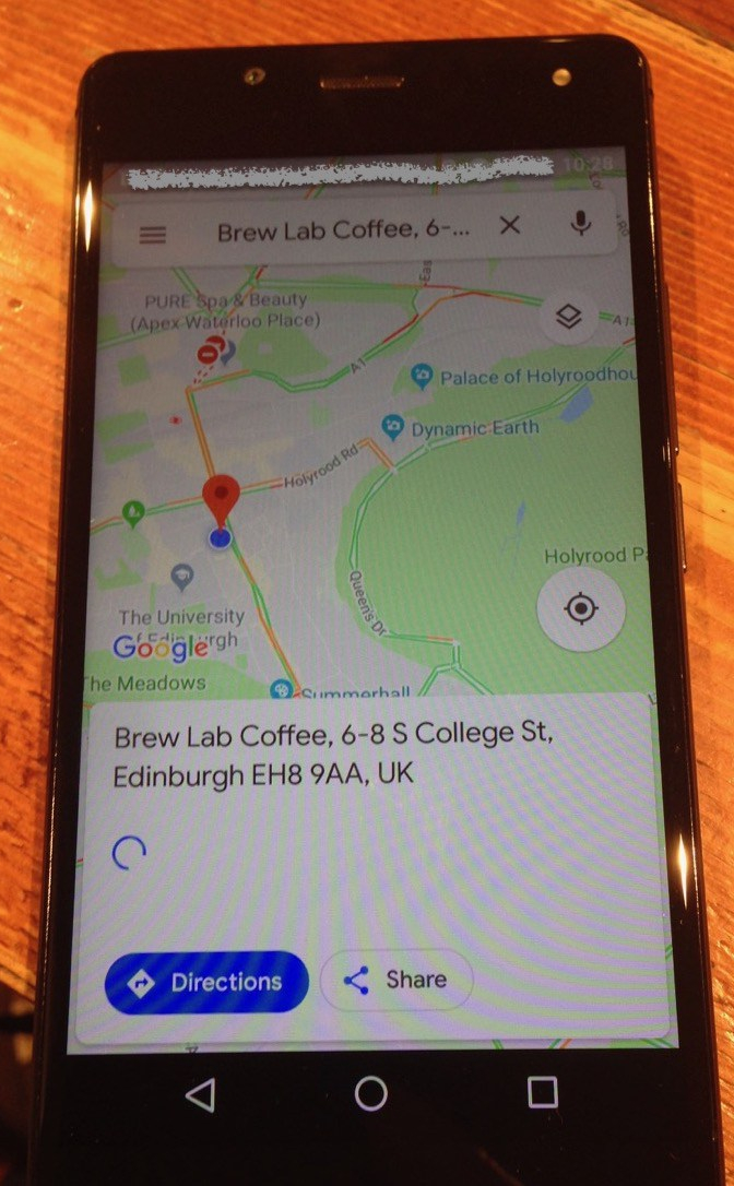 phone displaying map to Brew Lab Coffee shop