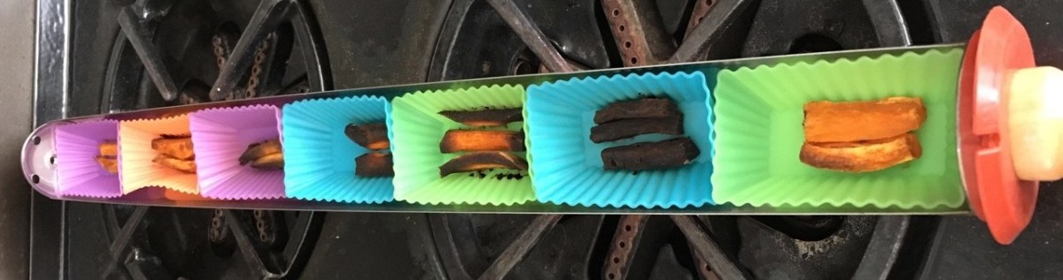 goSun Sport cooking tray filled with silicone cups of burned sweet potato fries