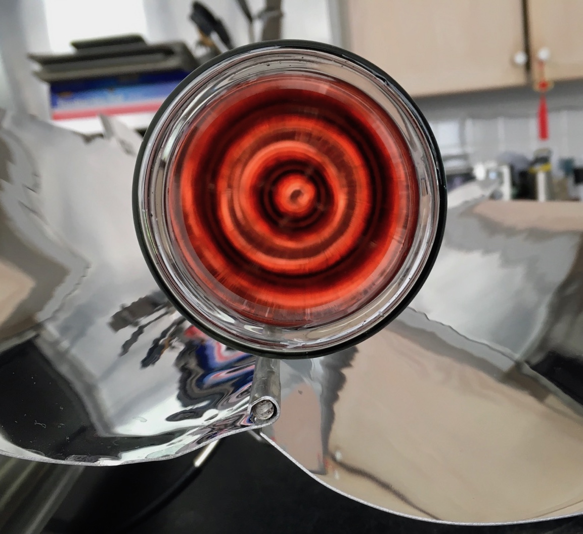 Mesmerizing red circle illusion inside goSun solar oven glass cooking tube