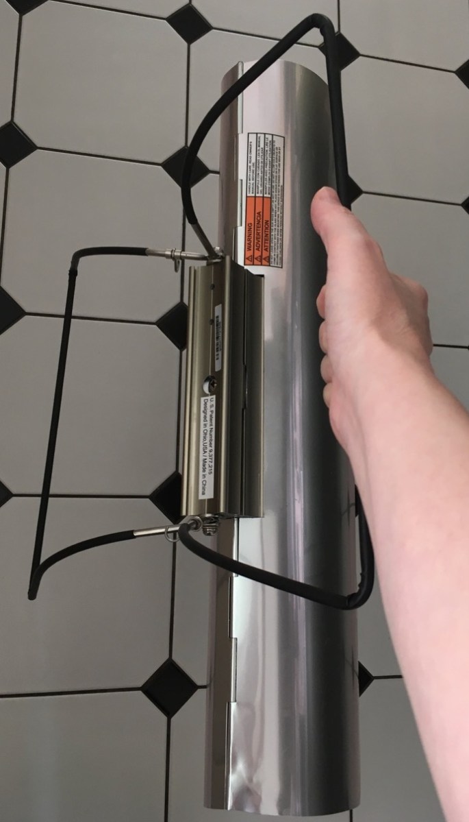 goSun Sport solar oven held in one hand to show portability