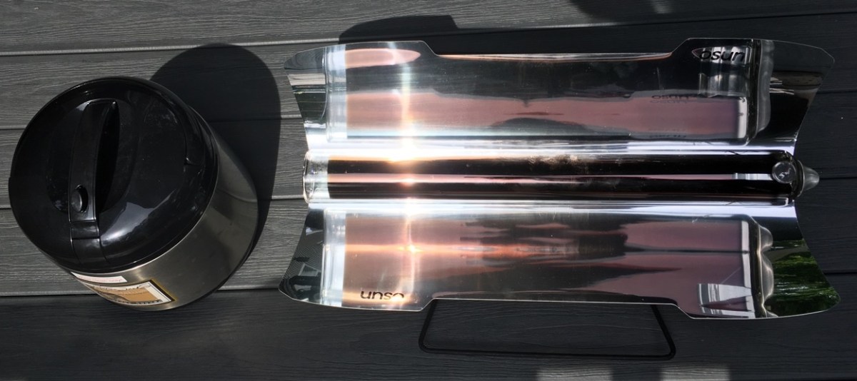 Saratoga Jack thermal cooker and GoSun sport solar oven sitting on deck