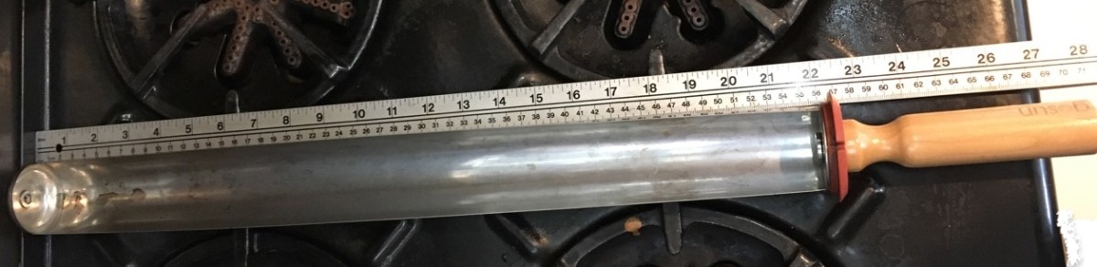 yardstick next to goSun oven tray measuring 28 inches long