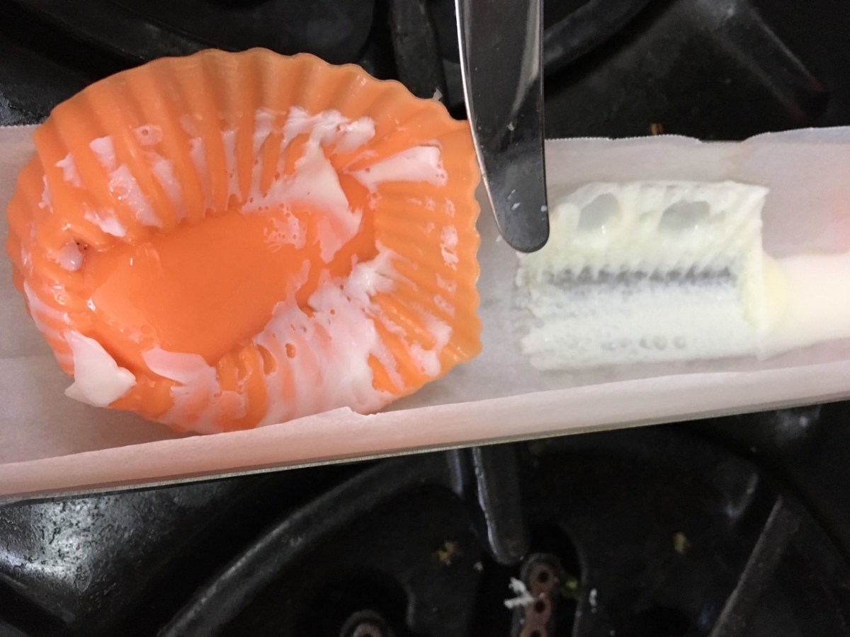 mess left behind after poaching egg in silicone muffin cup in solar oven