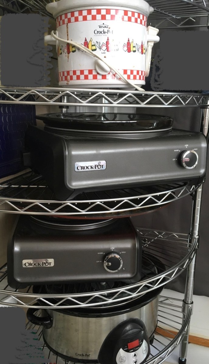 Wire corner shelving with 4 Crock Pot slow cookers of different types