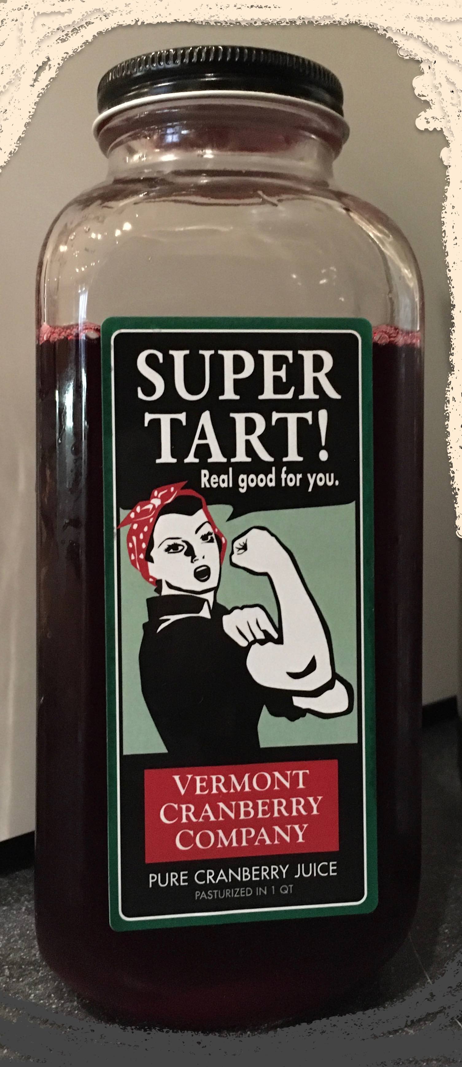 Glass bottle of Super Tart! Pure Cranberry Juice by VT Cranberry Co with Rosie the Riveter inspired artwork