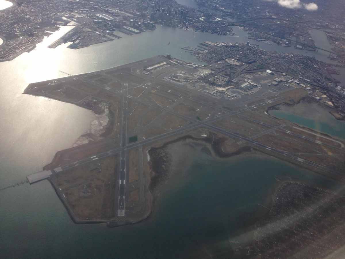 airport viewed from commercial plane window in the sky