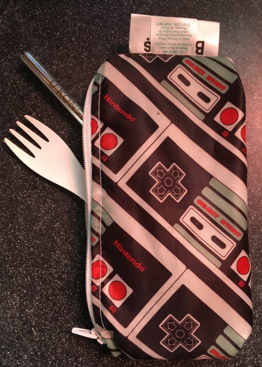 Bumkins zipper snack bag in Nintendo GameBoy print with white spork and stainless straw poking out