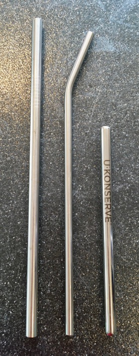 Three stainless steel straws, a long, straight one, an angled straw, and a shorter U-Konserve Mini straw about 2/3 the length of the others