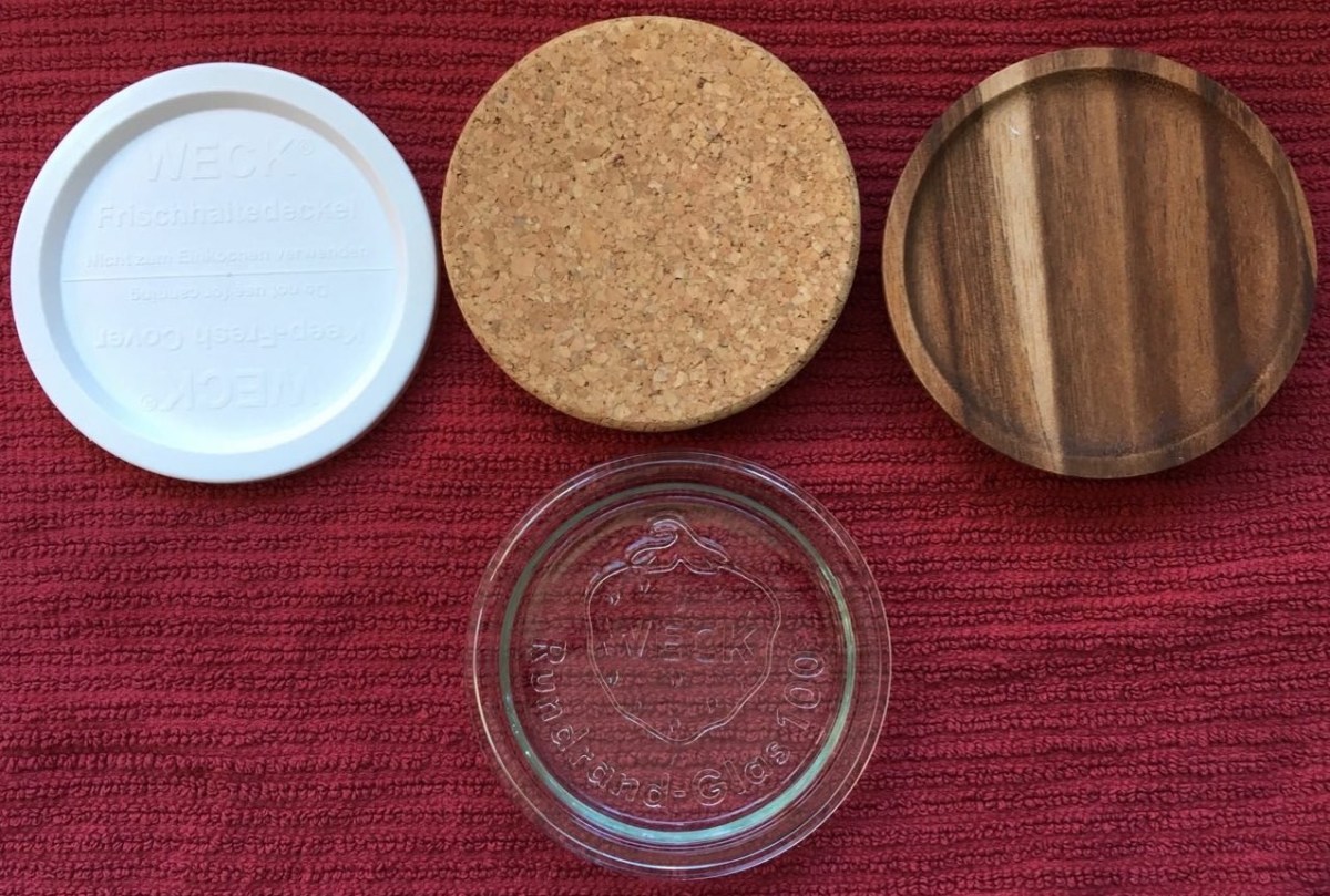 4 available Weck canning jar lids shown side by side: plastic, cork, wood, and glass