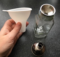 Funnels designed for filling flasks or oil jars are well sized to refill seasoning bottles