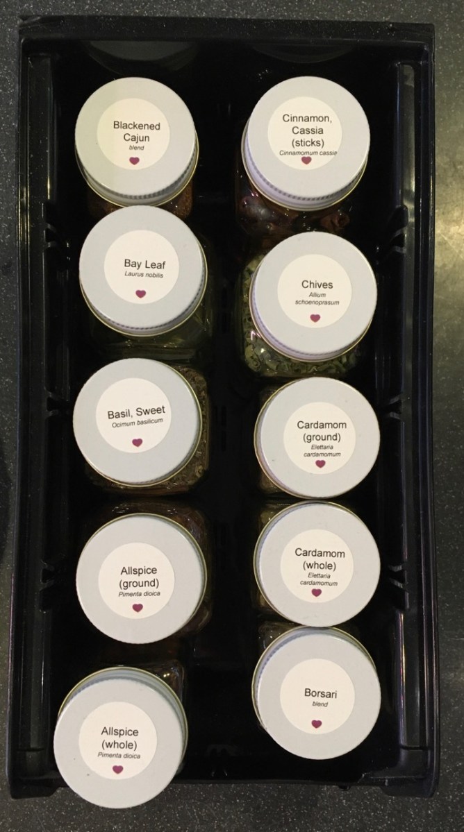 View from above showing ten SpiceLuxe jars in a bin