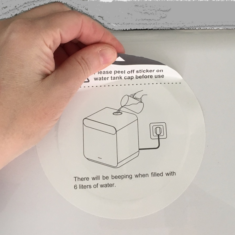 Peeling sticker off water tank fill cap before use