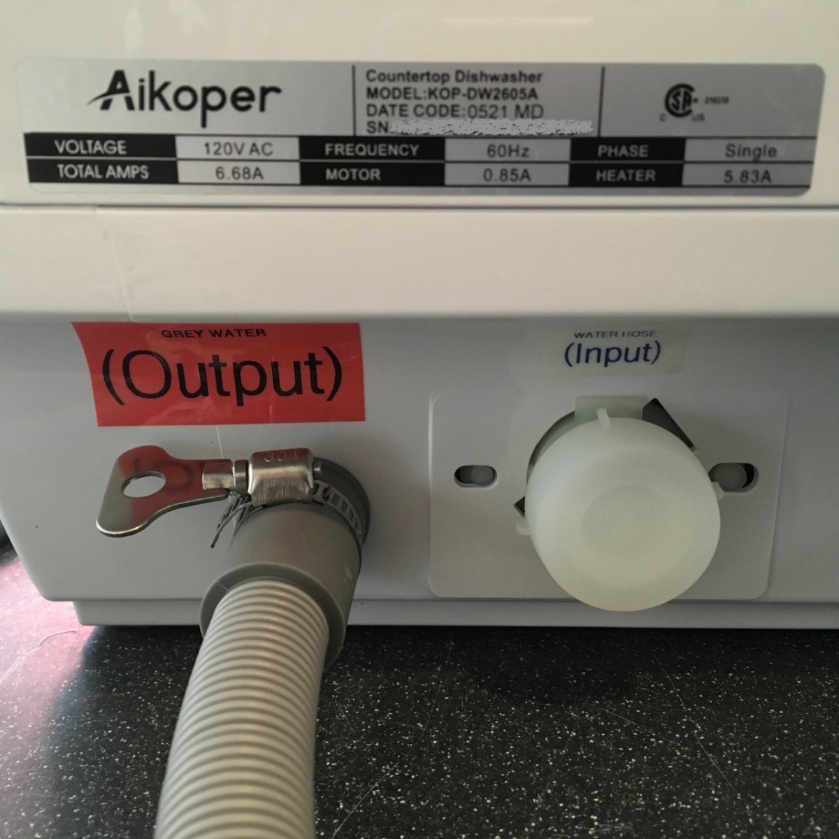 Self-printed Output and Input labels for the drain and water inlet port
