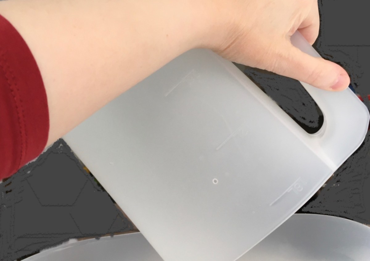 Filling water tank with pitcher tilted high to get last drops out