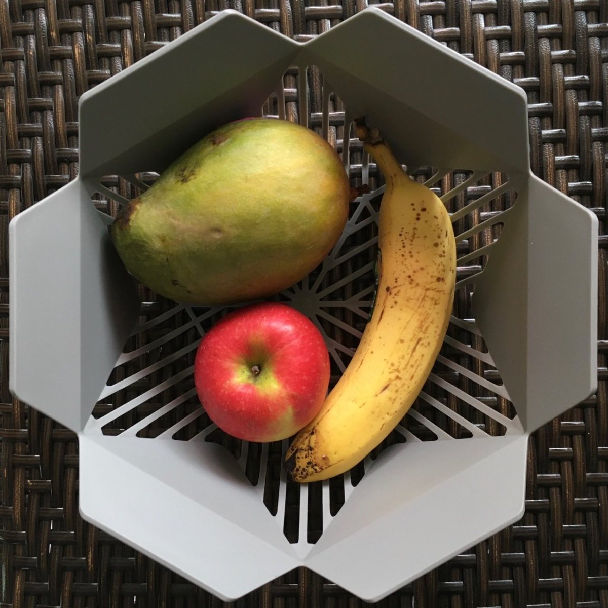 Mango, banana, and applie in fruit basket
