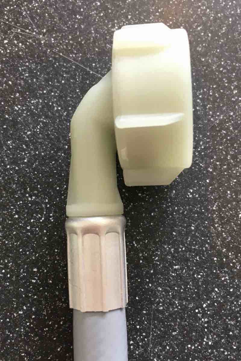 close up of appliance hose right angle connection end