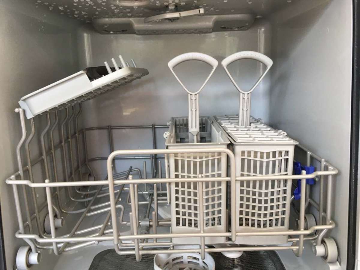 Both pieces of separable Bosch utensil bin inside dishwasher