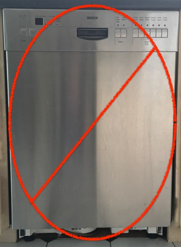 Red NO symbol crossing out broken stainless steel appliance