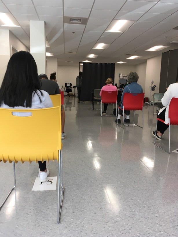 Patients during mandatory observation for side effects after coronavirus vaccination jab