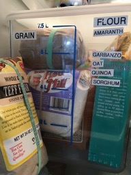 8L Rubbermaid tub full of flours including Amarnth, Garbanzo, Oat, Quinoa & Sorghum with Teff flour nearby