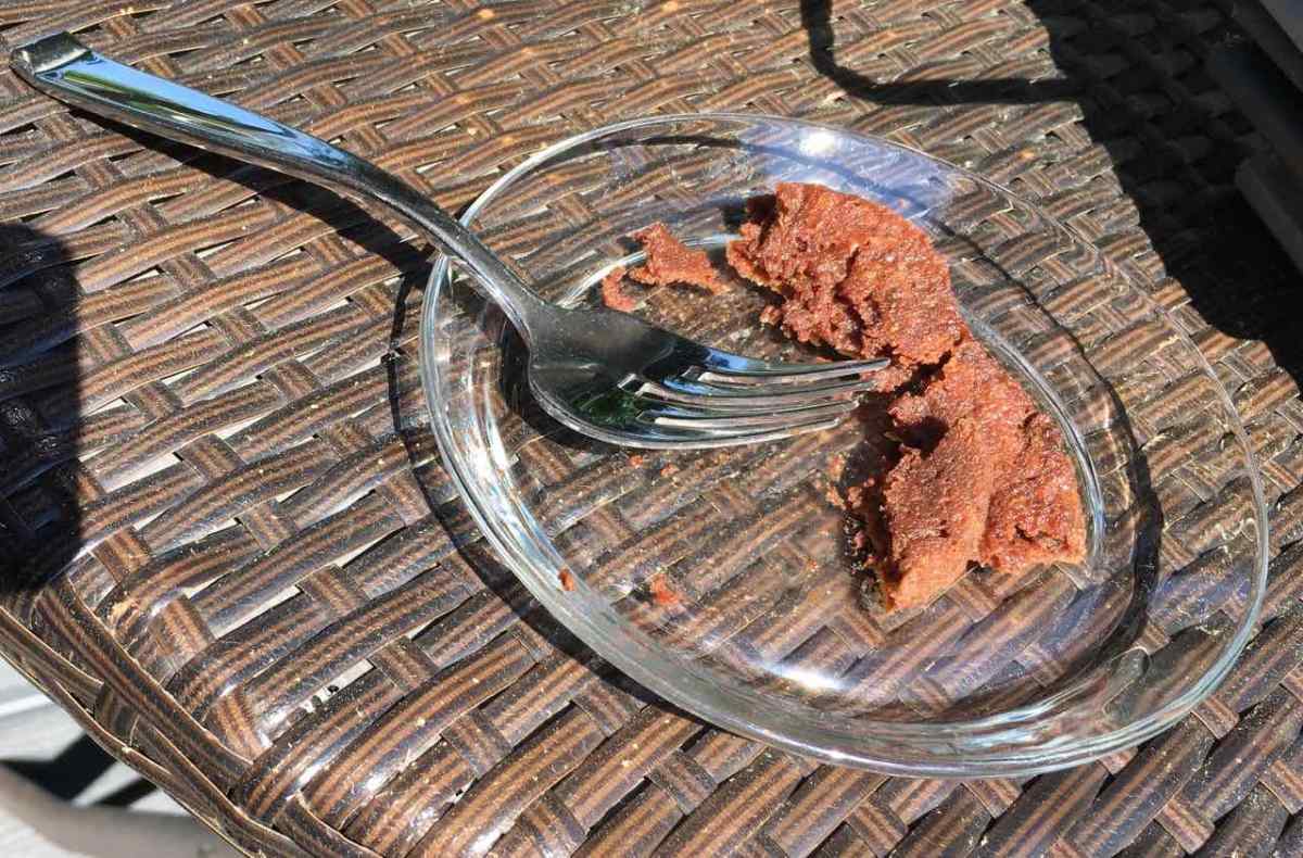 Microwave mug cake with gooey texture on glass plate with fork