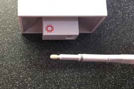COVID test Cue Health cartridge in Reader and Swab - 1