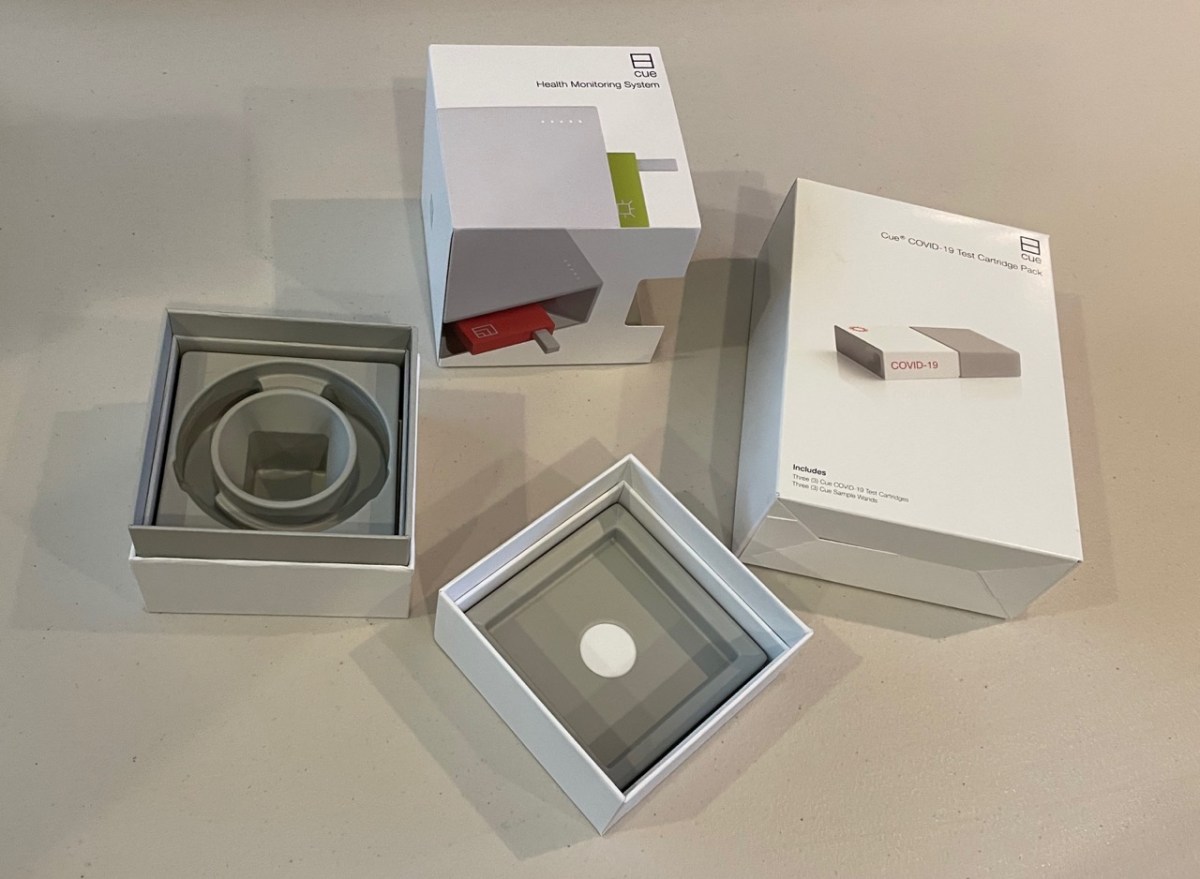 Cue Reader carton and box alongside test cartridge carton