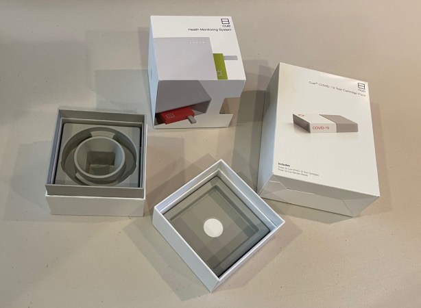 Cue Reader carton and box alongside test cartridge carton