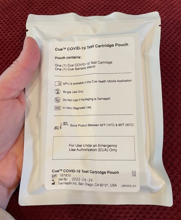 Sealed pouch with test cartridge outside of sales carton