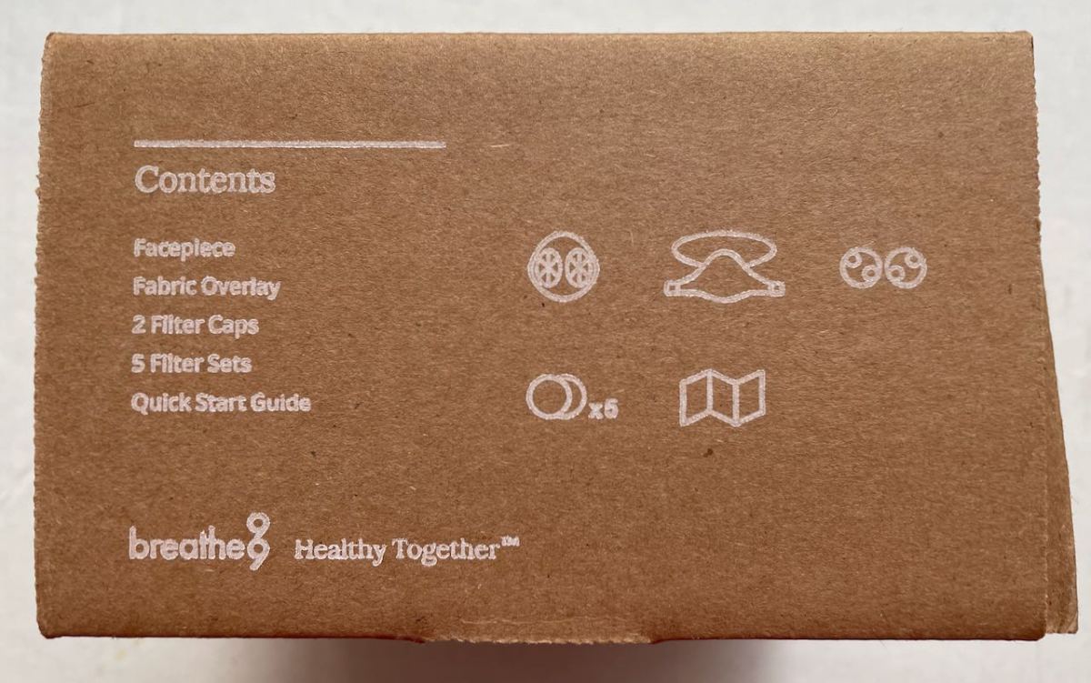 B2 Mask carton side showing content list of facepiece, overlay, filter caps, 5 filters, quick start guide