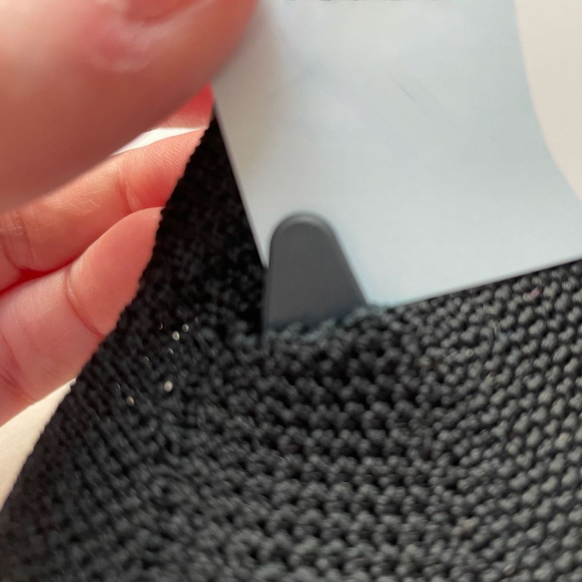 B2 Mask face piece tab poking through slot in cloth overlay