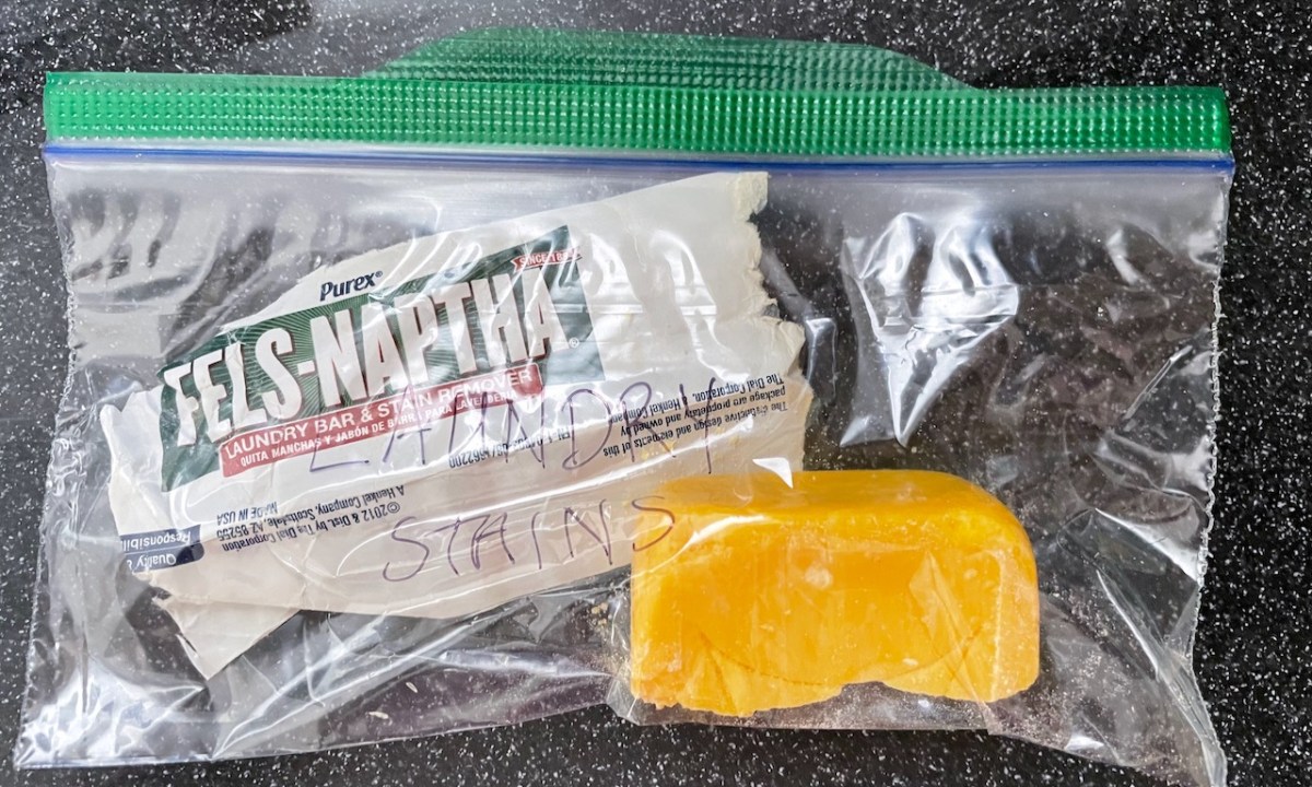 Fels-Naptha wrapper and detergent in a Ziploc baggie with laundry stains scrawled on it