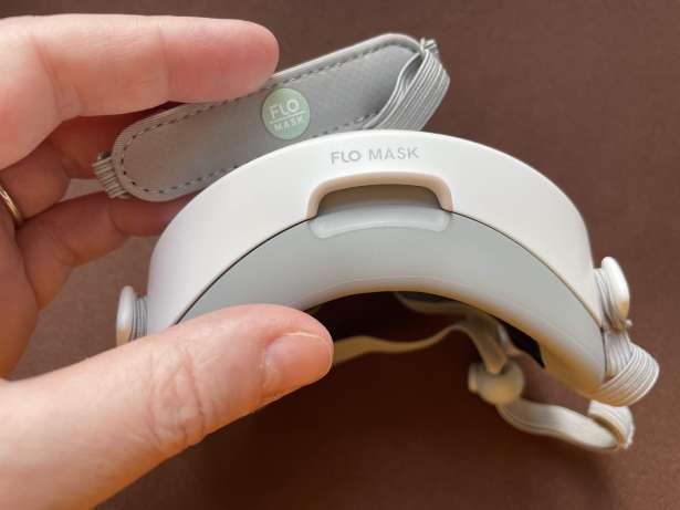 FLO Mask brand shows on two places: back of head strap and bottom of front cover under user's chin