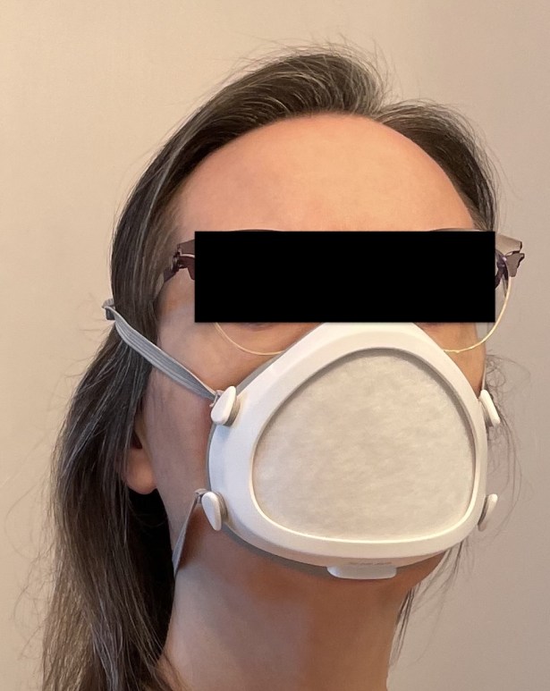 Woman wearing white FLO mask