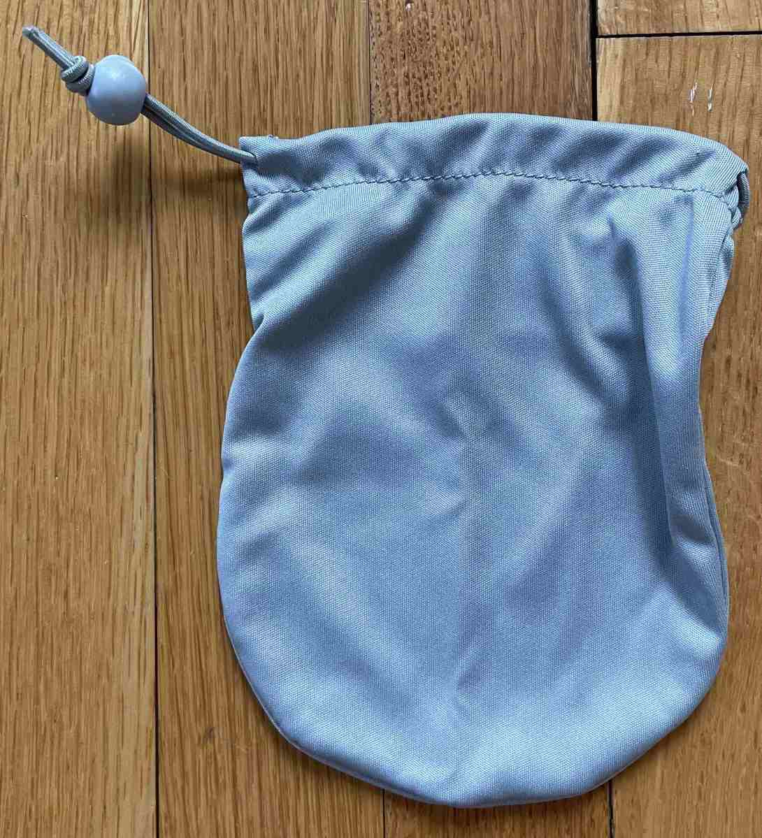 Grey microfiber drawstring storage pouch without markings