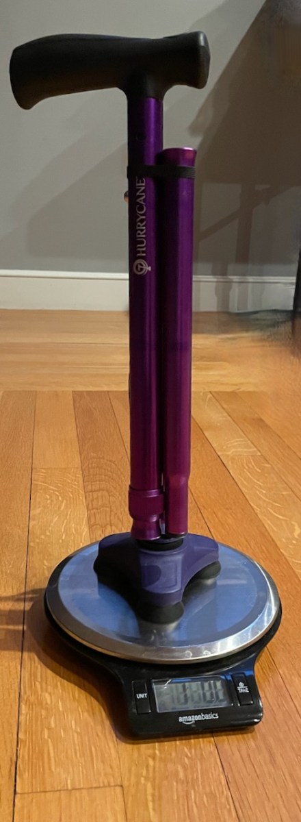 Folded HurryCane standing on kitchen scale