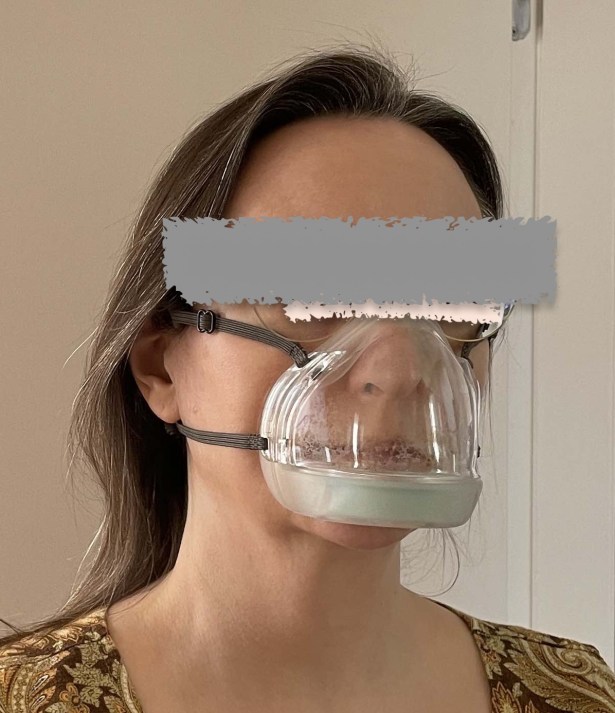 Woman wearing clear plastic Reveal mask