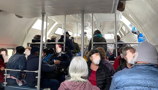 Crowded tender in the morning with every bench full