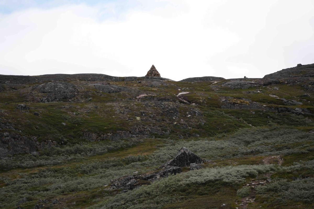 Wayfinding rock cairn atop hill in Qaqortoq, Greenland