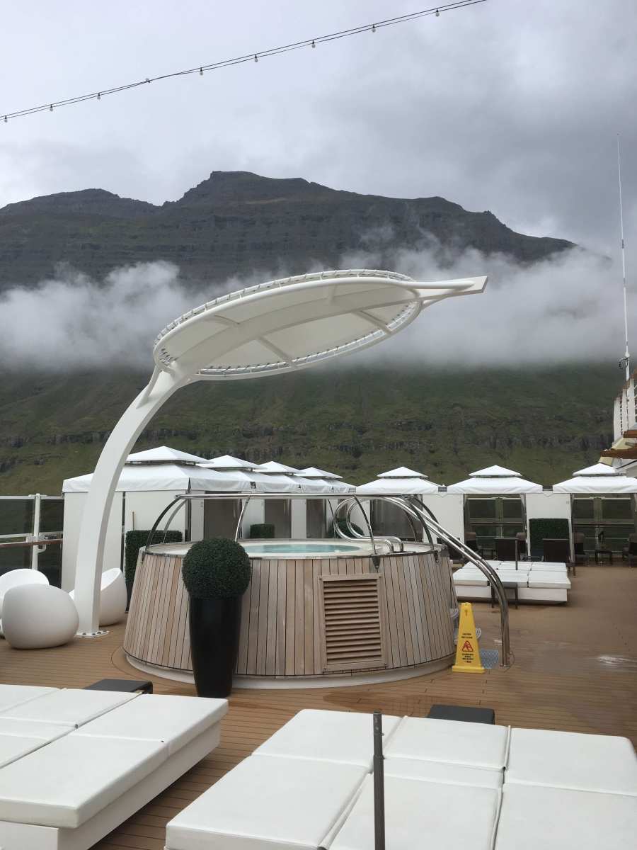 Mist shrouded hills around Seyðisfjörður, Iceland as seen from vacant Cabana deck