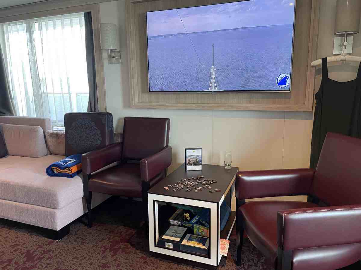 View of jigsaw puzzle in progress on coffee table with seating for four nearby