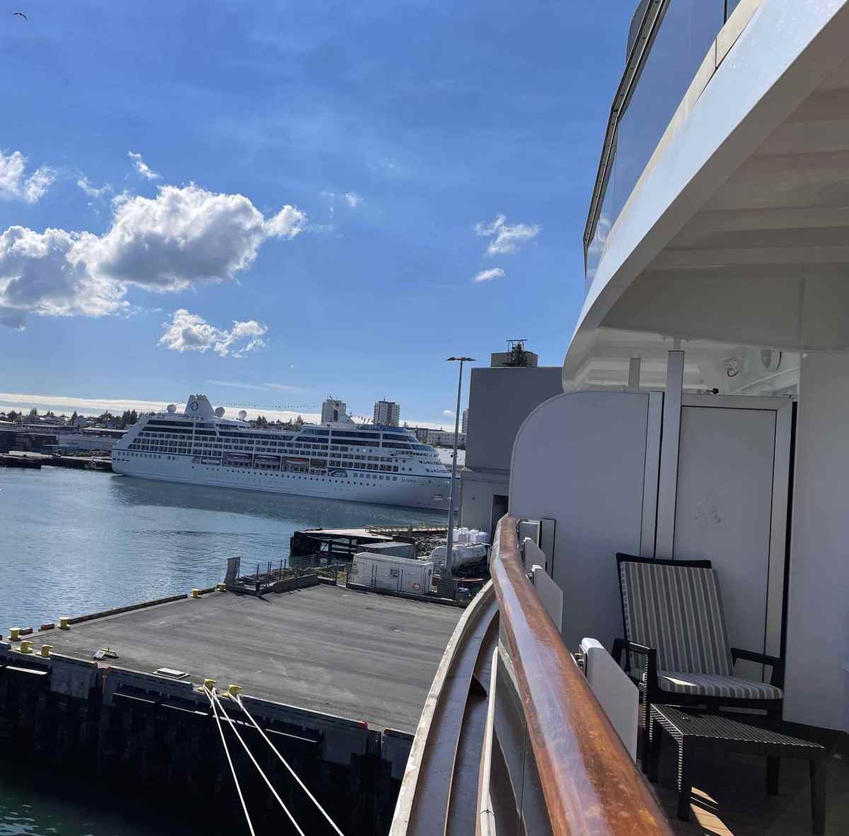 Smaller side of the wraparound balcony is still wide enough for 4 at dining table