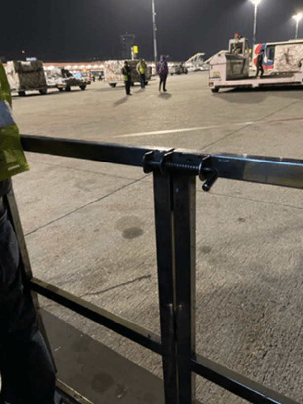 Tarmac beyond exit gate from scissor lift with gate still closed